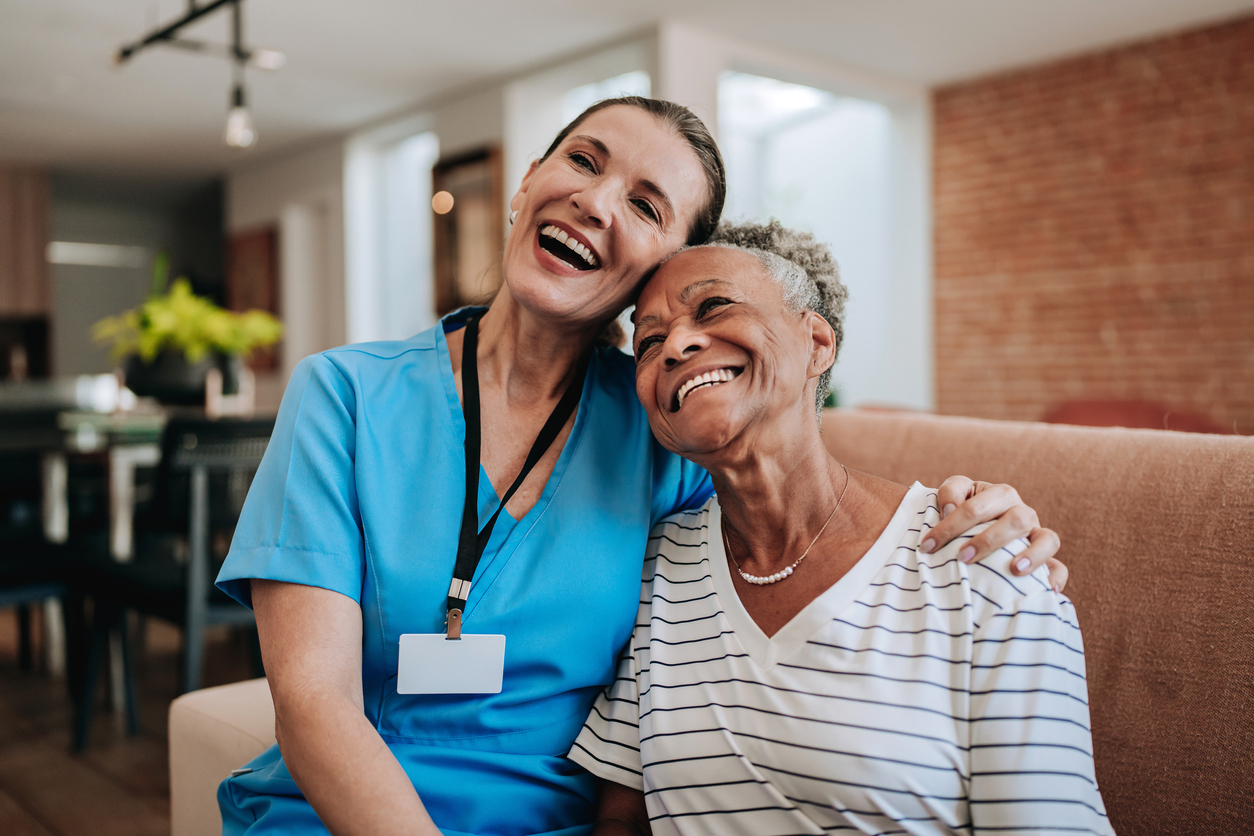 Home care healthcare professional hugging elderly patient Home care healthcare professional hugging elderly patient